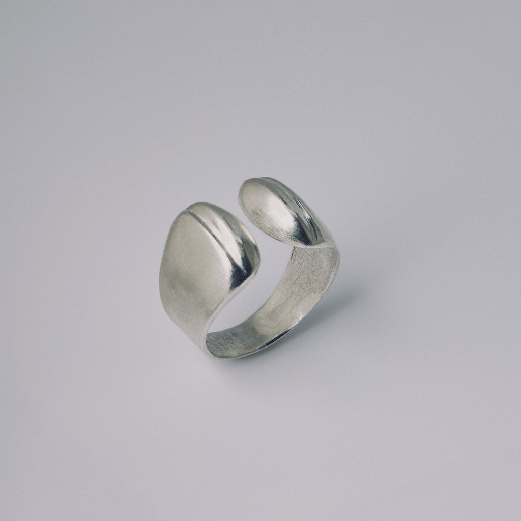 Silver ring on a gray background