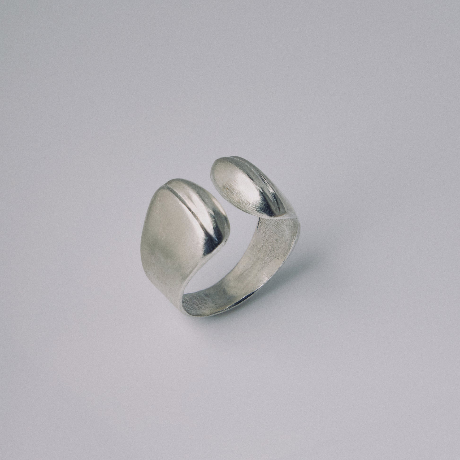 Silver ring on a gray background