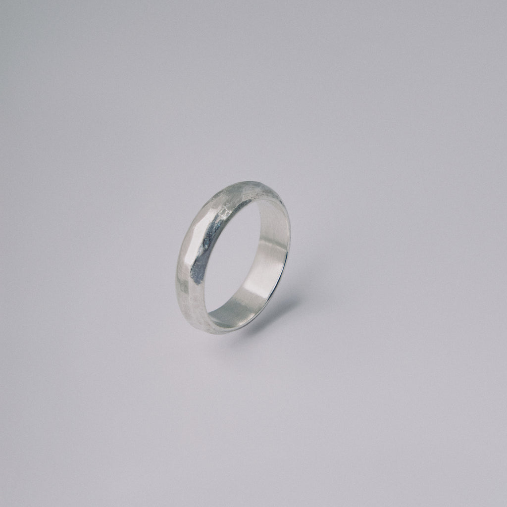 Silver ring on a gray background