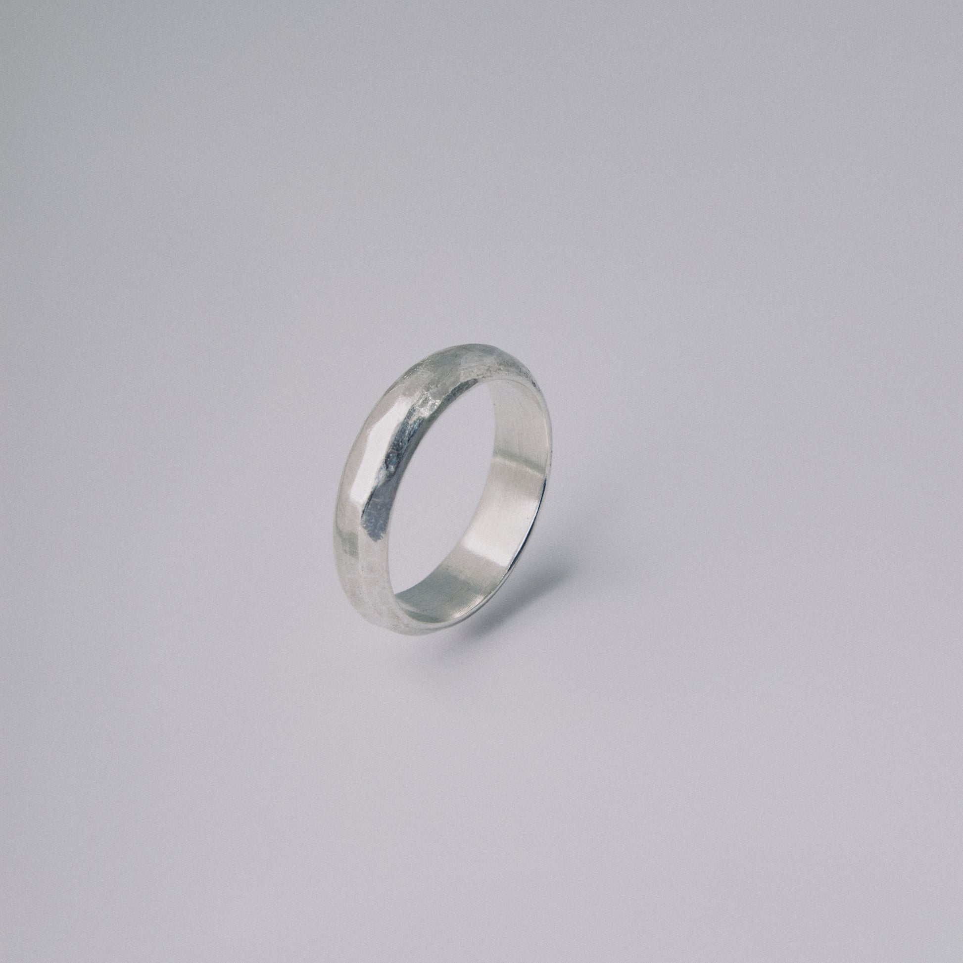 Silver ring on a gray background