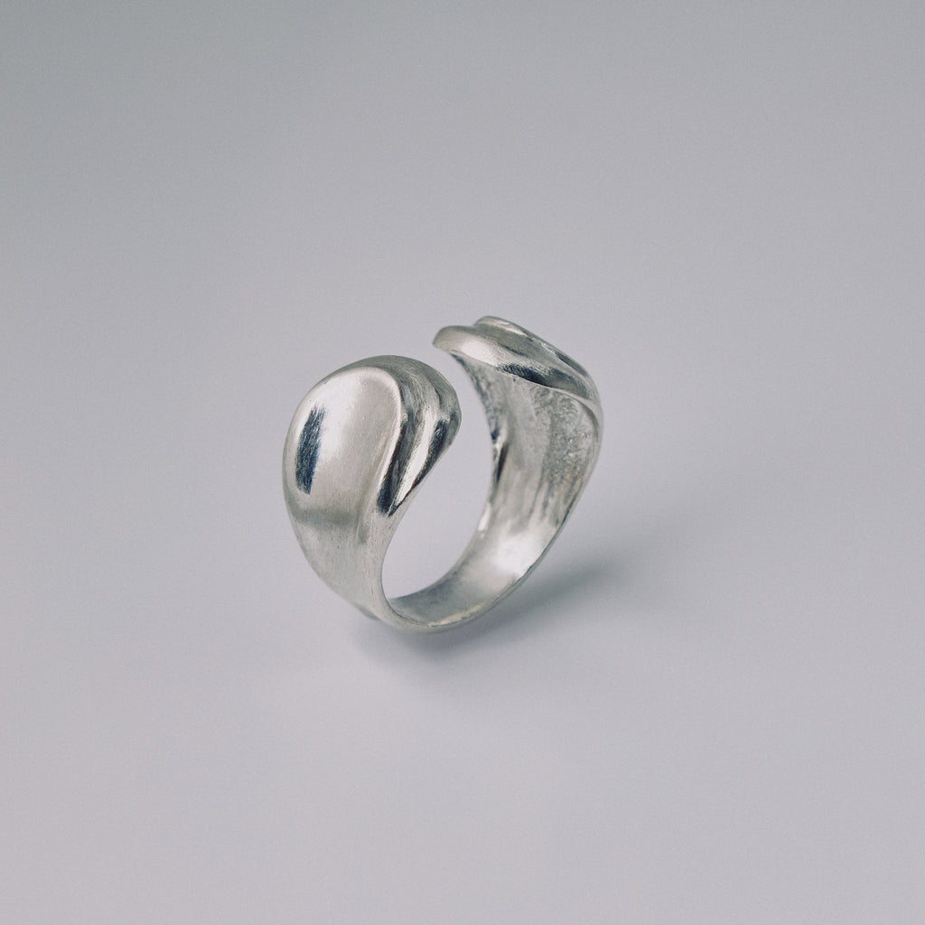 Silver ring on a gray background