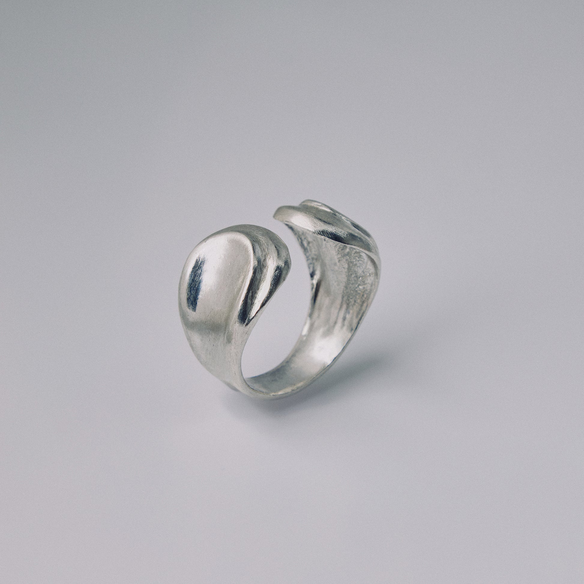 Silver ring on a gray background
