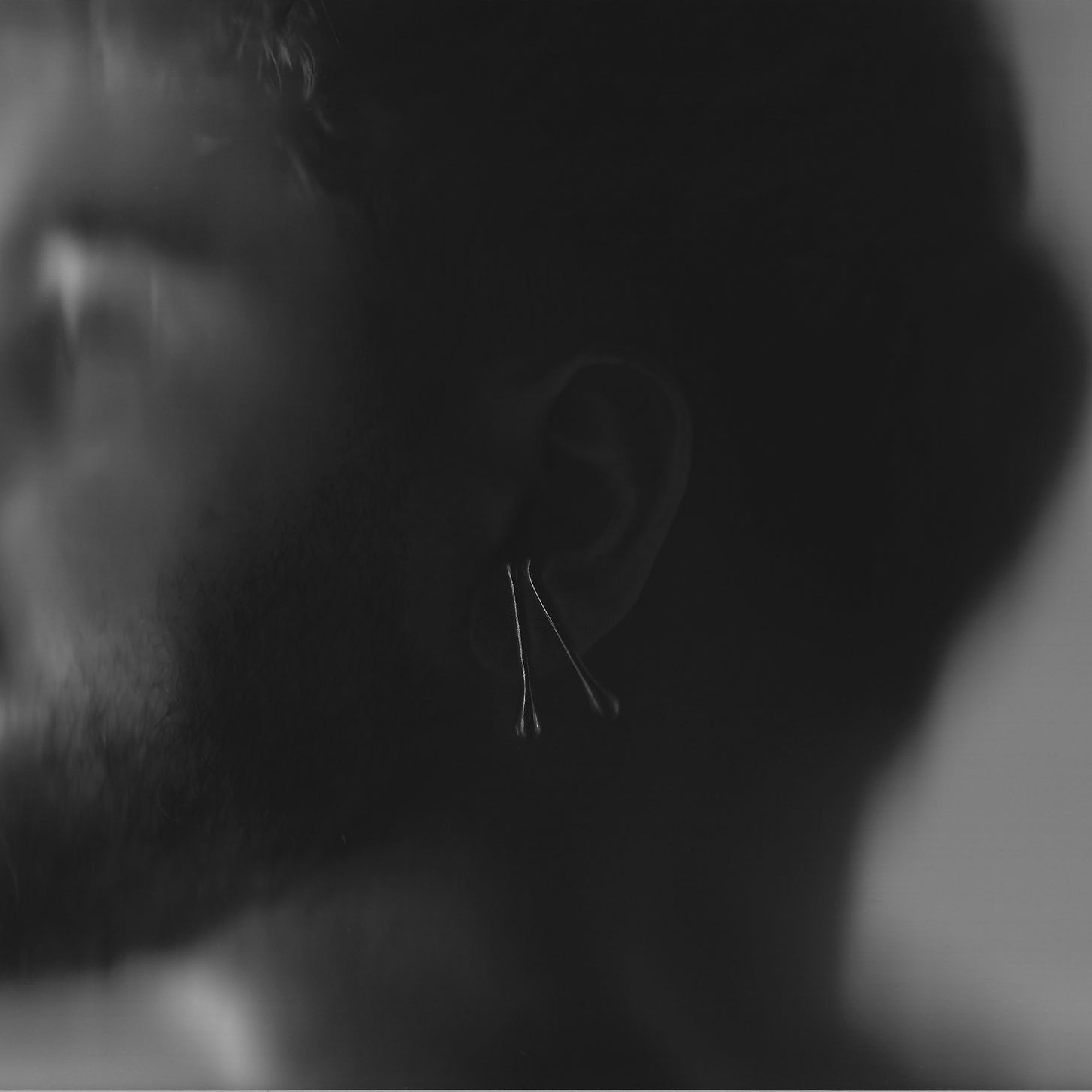 Close-up of a person's ear with a blurred background