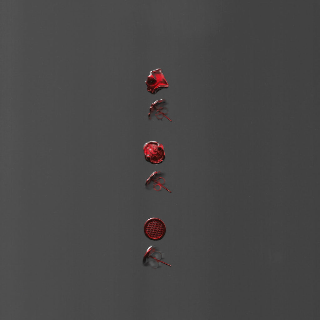 Red wax seals arranged vertically on a gray background