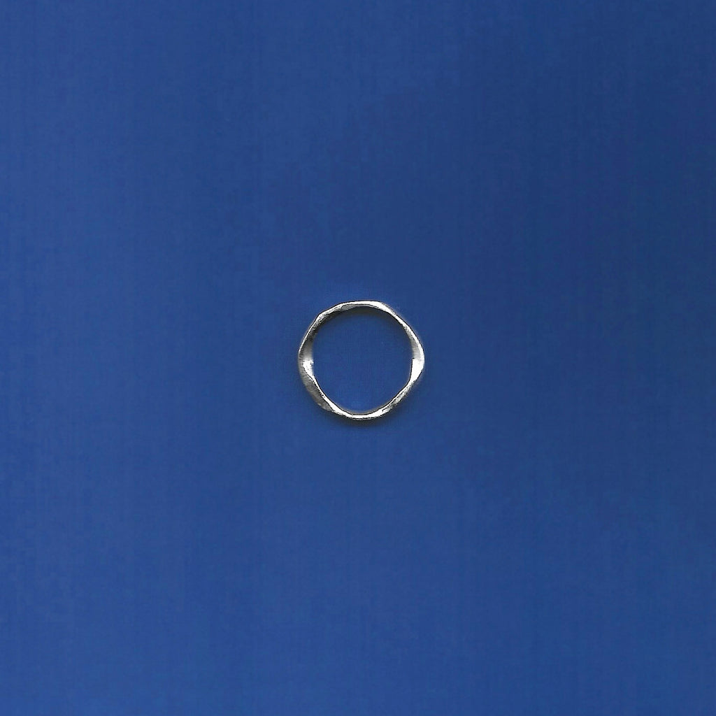 Silver ring on a blue background