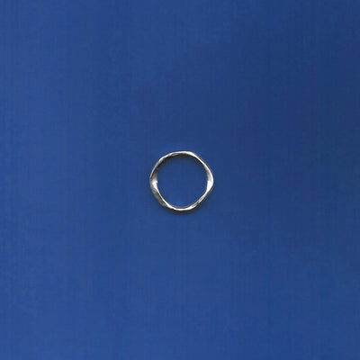 Silver ring on a blue background