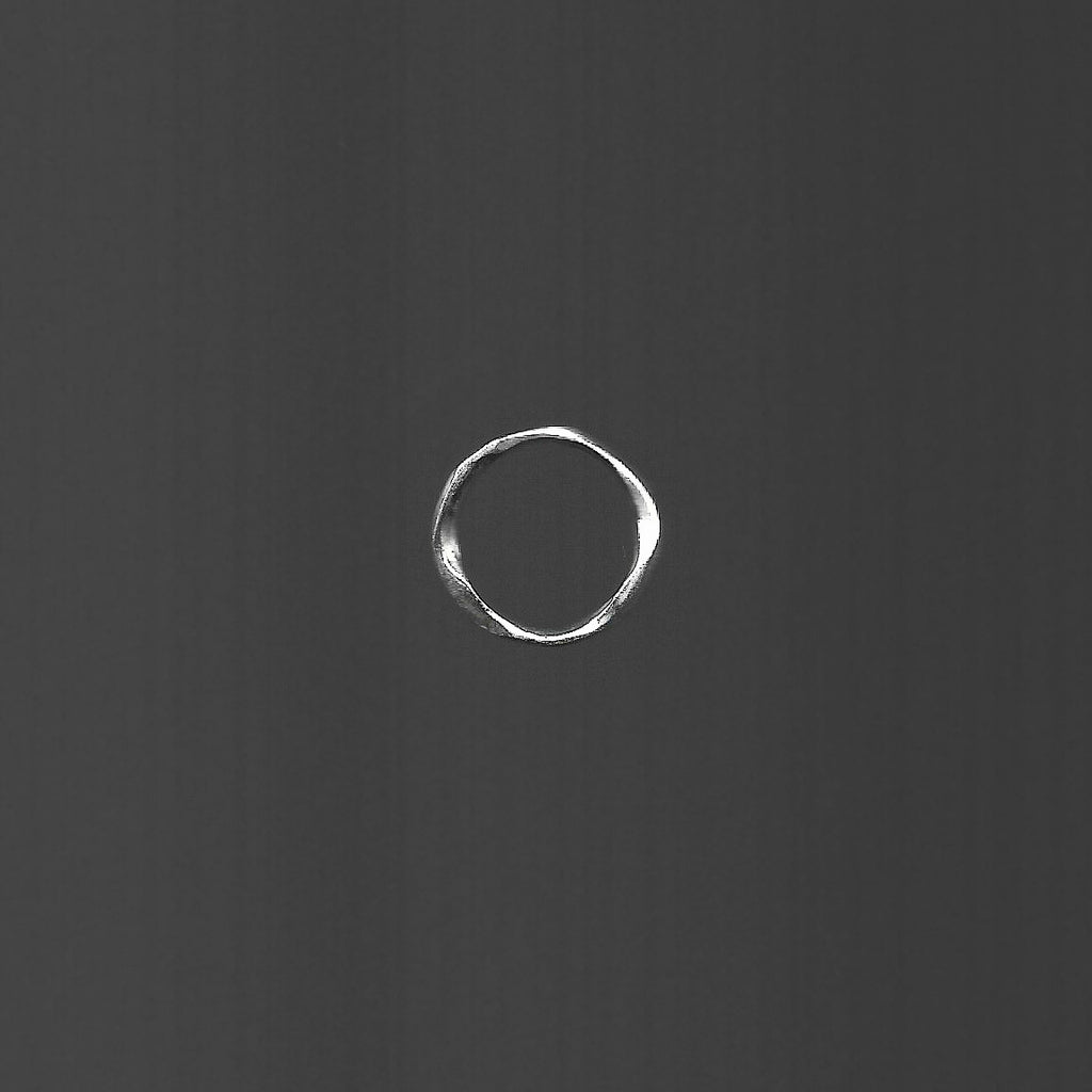 White circle on a dark gray background