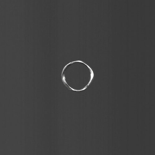White circle on a dark gray background