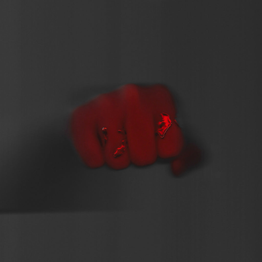 Red fist on a dark gray background