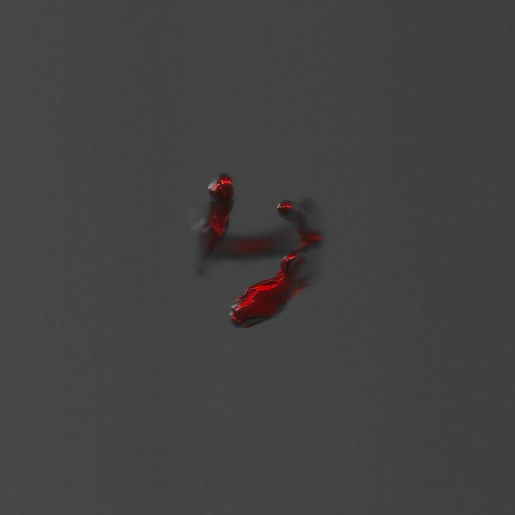 Red liquid droplets on a gray background