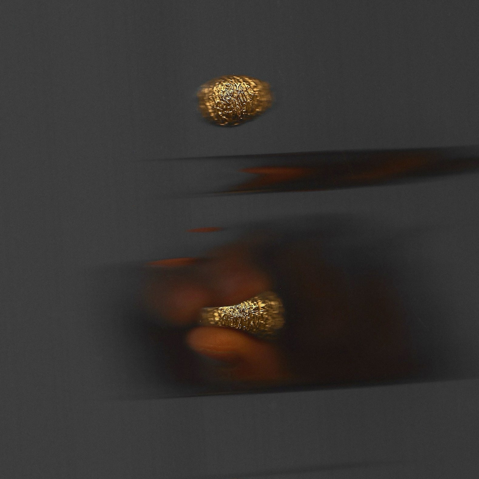 Gold ring on a dark gray background
