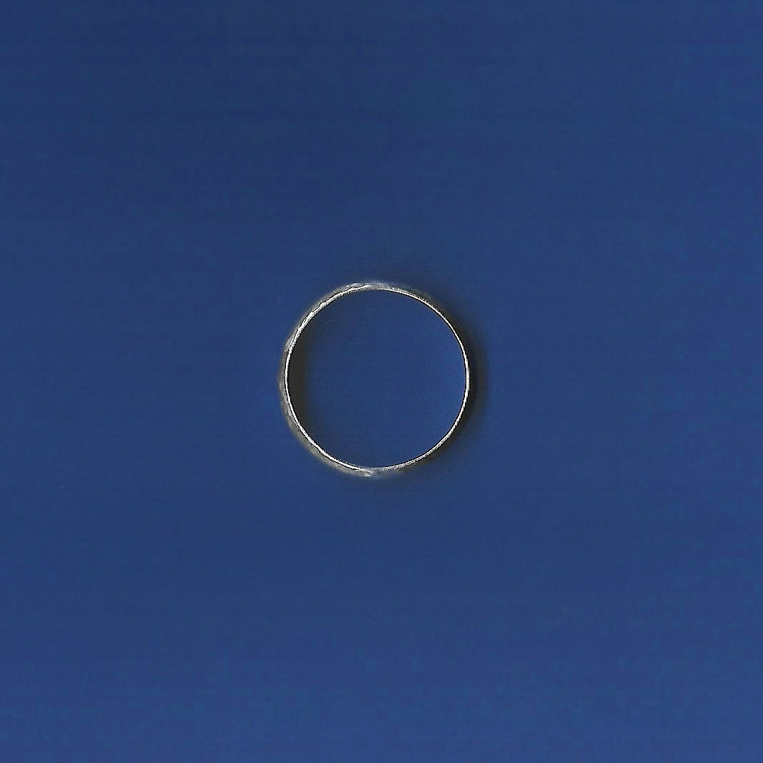Silver ring on a blue background