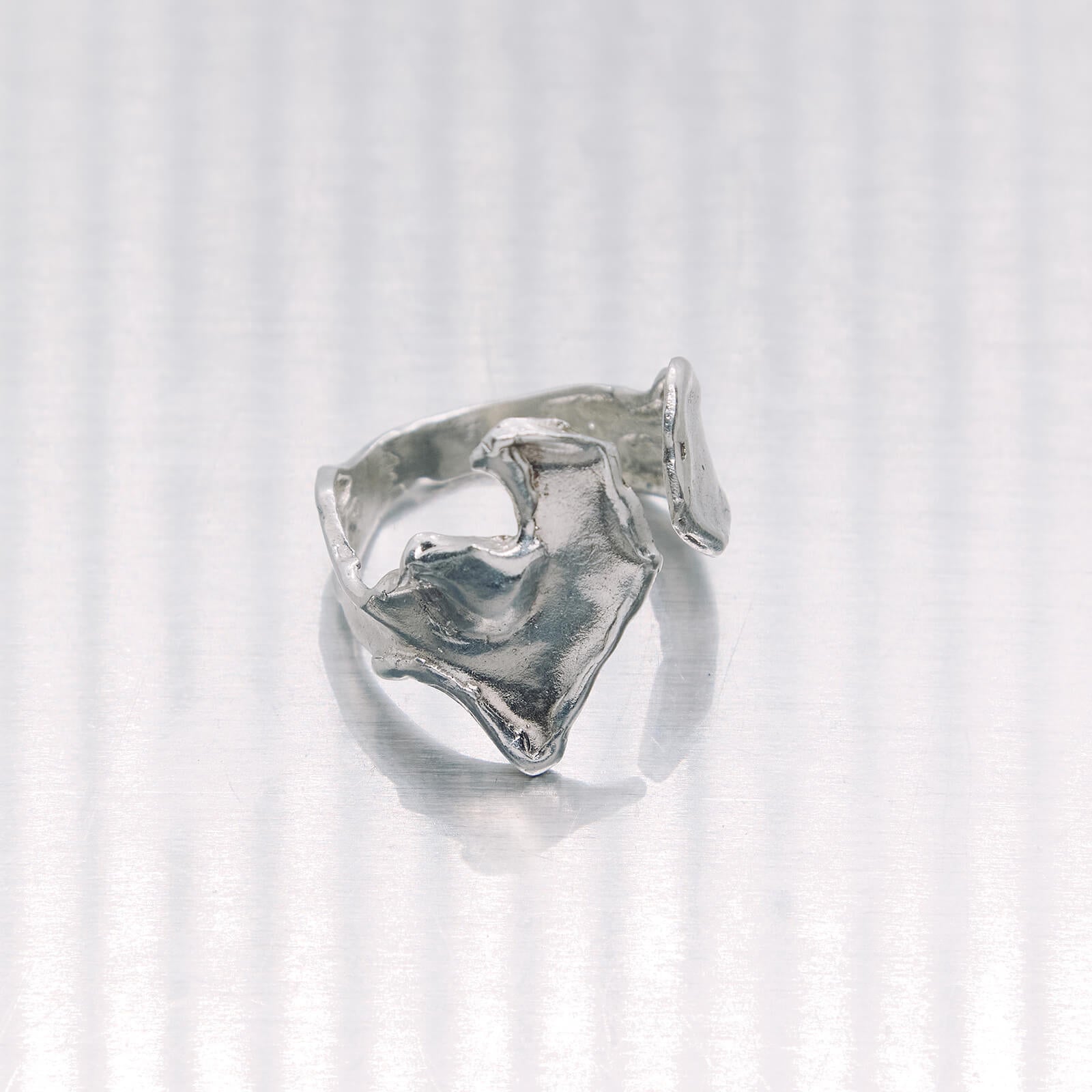 Silver ring on a white background