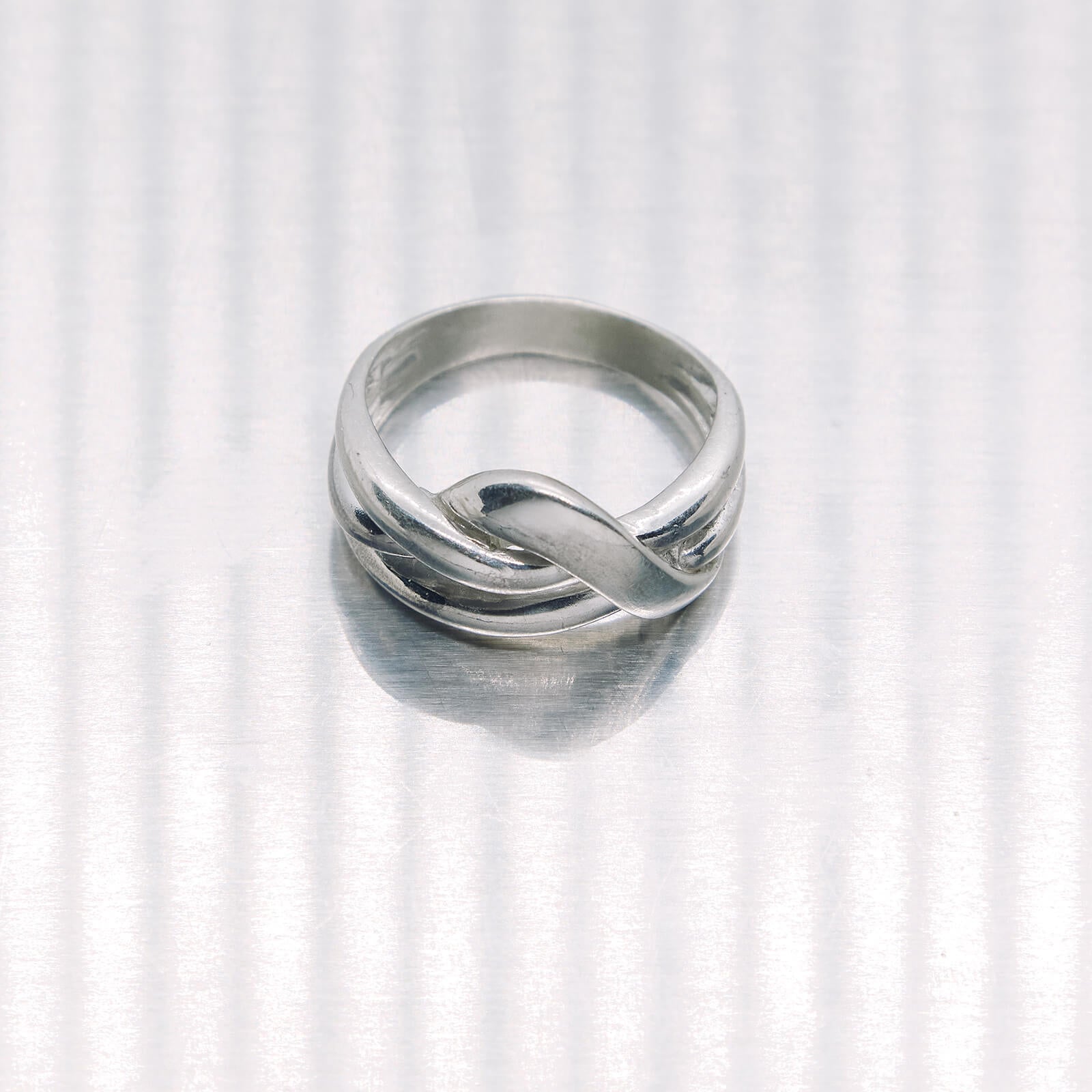 Silver ring on a white background