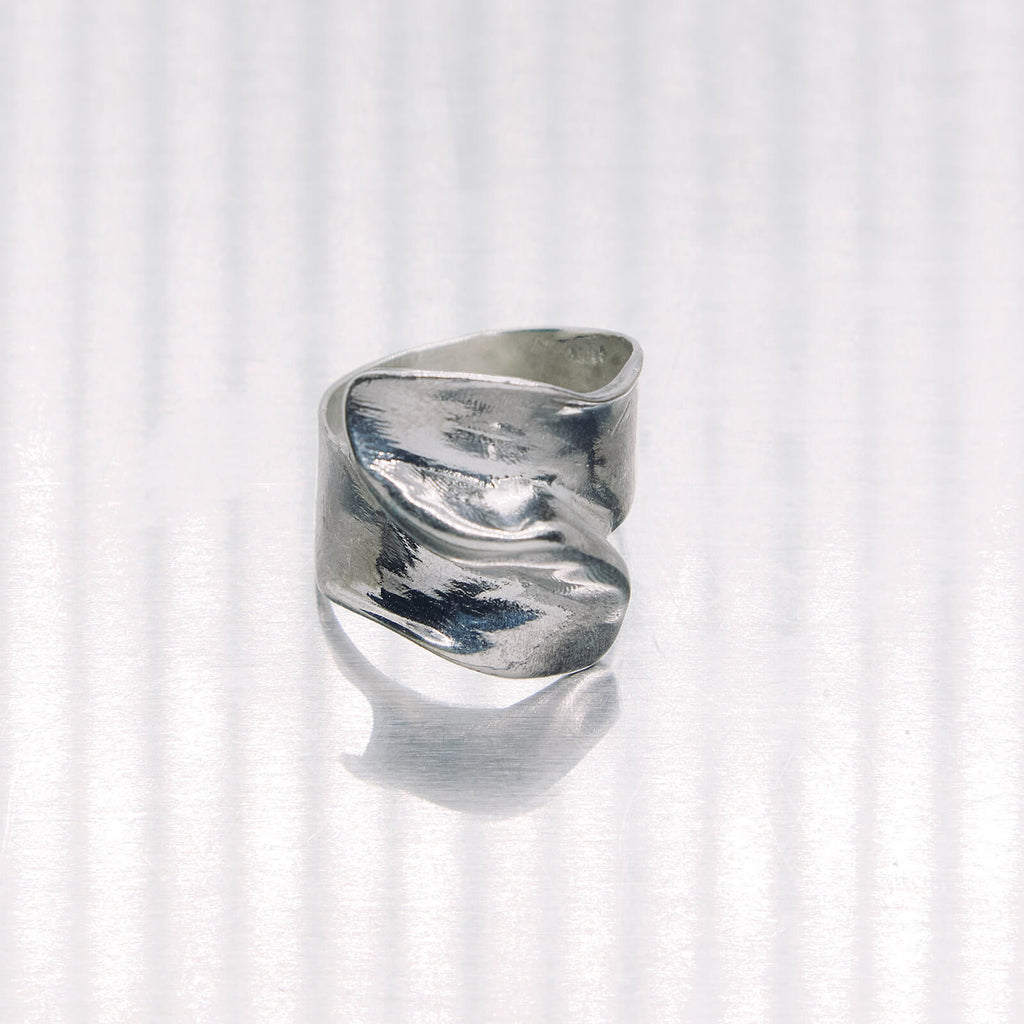 Silver ring on a white background