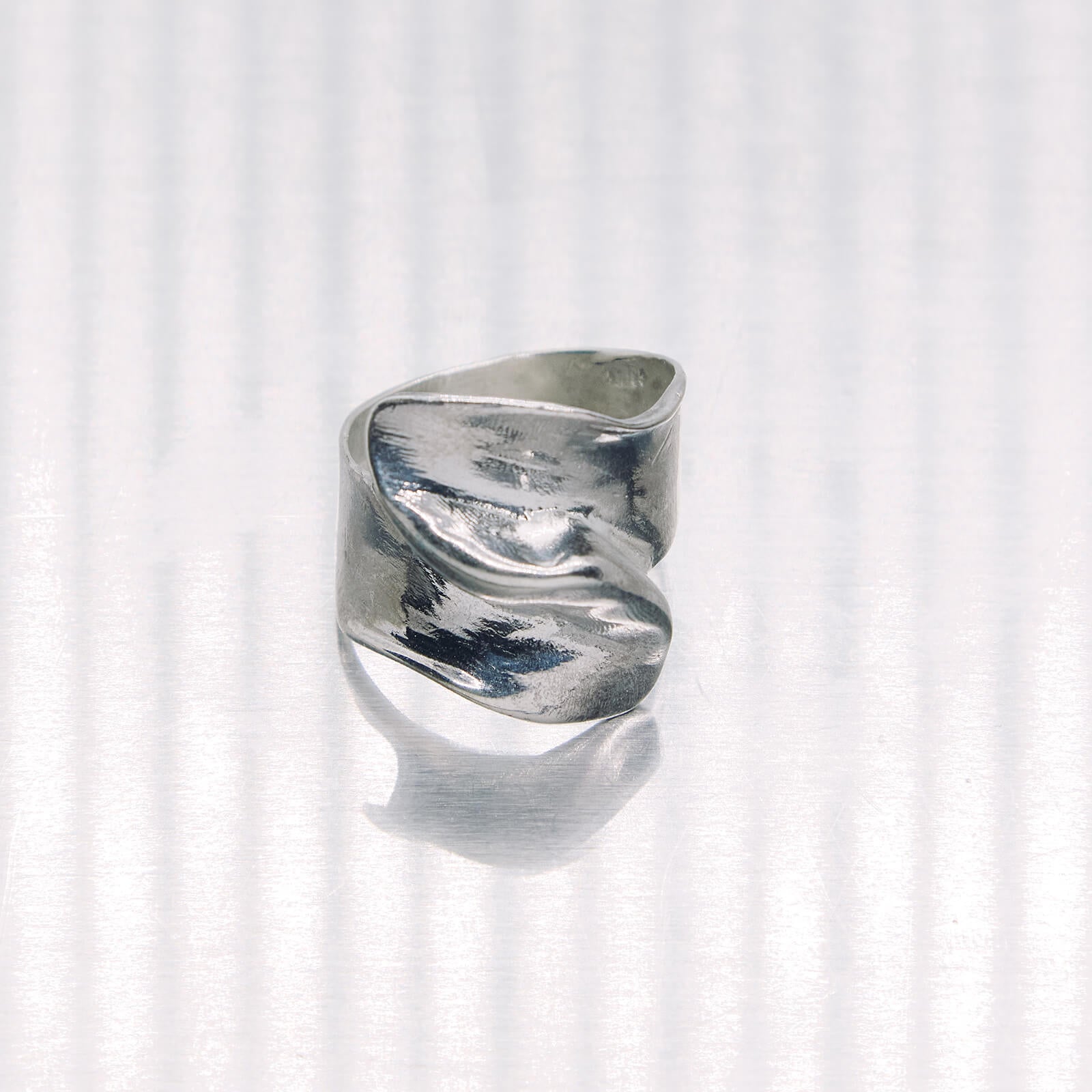 Silver ring on a white background